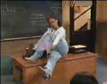 woman-on-desk-in-classroom