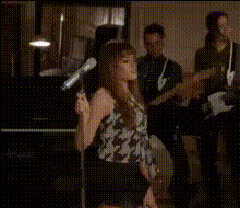 woman-singing-with-band