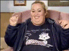 woman-sitting-on-chair-laughing