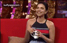 woman-smiling-on-couch