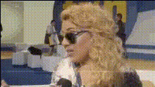 woman-wearing-sunglasses-speaking
