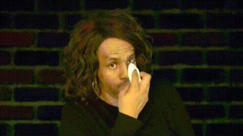 woman-wiping-away-tears-laughing