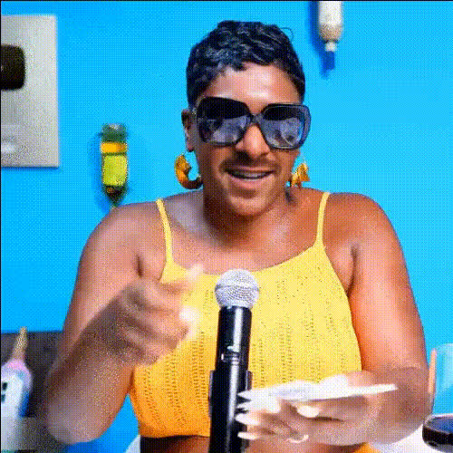woman-with-sunglasses-and-mic