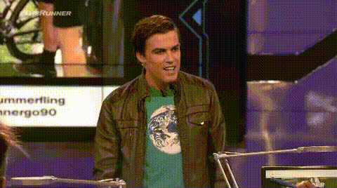 young-man-smiling-on-tv