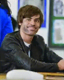 zac-efron-sitting-at-desk